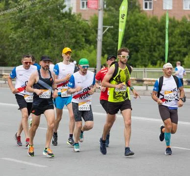 A group of athletes performs a race Stock Photos