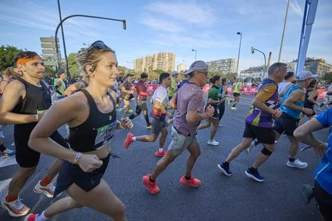 Group of athletes running in the opening segment of the Valencia Marathon Stock Photos