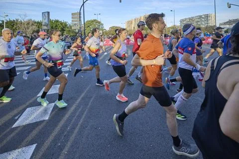 Group of athletes running in the opening segment of the Valencia Marathon Stock Photos
