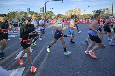 Group of athletes running in the opening segment of the Valencia Marathon Stock Photos