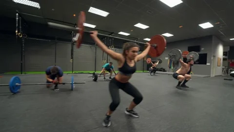 Group of athletes training weight lifting at gym Stock Footage 144130809