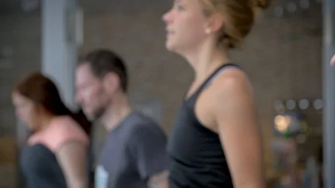 Group of athletic people using jump ropes for their workout in a cross-training Stock Footage 112354664