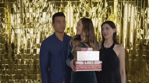 A group of attractive friendly guys make many gifts to the viewer. 4K 스톡 동영상 108757410