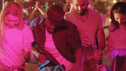 Group of attractive mixed race friends enjoying dancing off together on modern Stock Footage 115358193