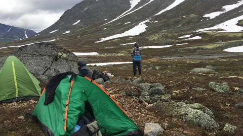 Group of backpackers make an overnight stop at mountainous plateau. Russia Stock Footage 207688149