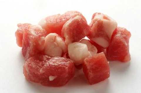 Group of bacon into cubes on a white background Stock Photos