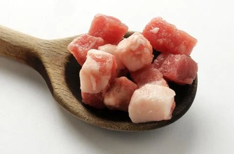 Group of bacon cubes on a white background Stock Photos
