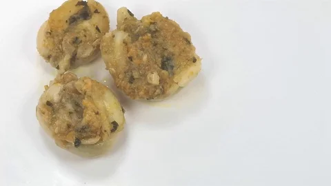 Group of baked cuttlefish with vegetable greens Stock Footage 103083051