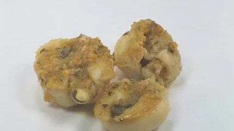 Group of baked cuttlefish with vegetable greens Stock Footage 103083052