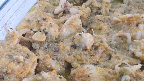 Group of baked cuttlefish with vegetable greens Stock Footage 103083054