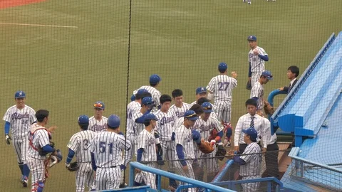A group of baseball player in Meiji Jingu Stadium in Tokyo Japan Stock Footage 125766201