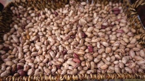 Group of beans fall into the wicker basket- slow motion Stock-Footage 77373547