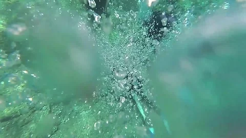 A group of beginner divers with an instructor do underwater exercise in slow Stock Footage
