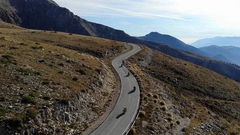 Group of bikers riding in mountains Stock Footage 106948189