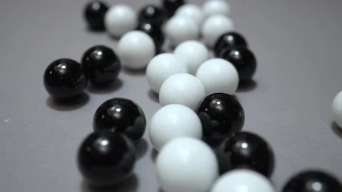 Group of black and white balls change position after impact Stock Footage 147462555
