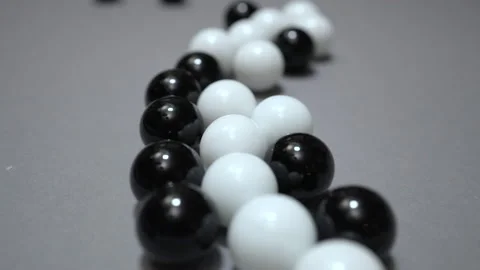 Group of black and white balls change position after impact Stock Footage 147462823