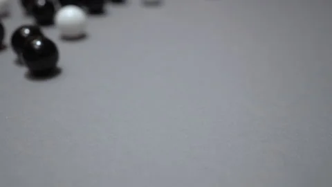 Group of black and white balls rolling toward camera Stock Footage 147463432