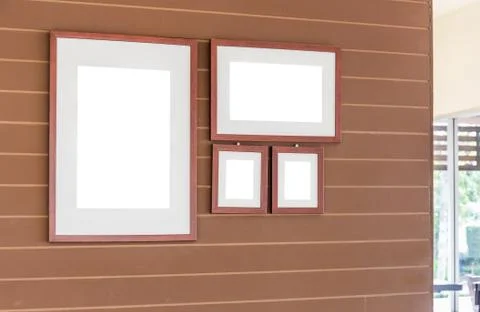 Group of Blank photo frames on the wall for your design Фото