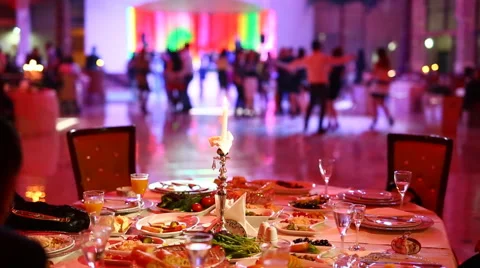 Group of blurred people dancing in a dark banquet hall for a wedding reception Stock Footage