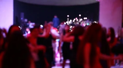 Group of blurred people dancing in a dark banquet hall for a wedding reception Stock Footage 62321341