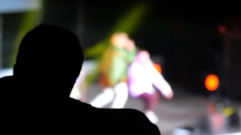 A group of blurred singers perform at an open concert. Stock Footage 112751467