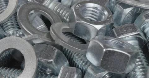 A group of bolts, nuts and washers close up. Fasteners. Stockbeeldmateriaal 160291673