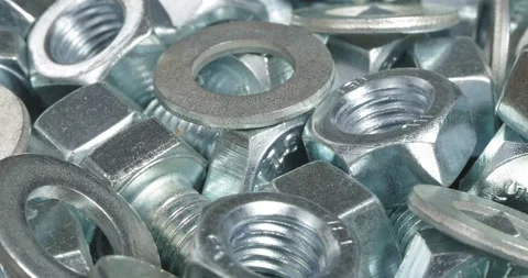 A group of bolts, nuts and washers close up. Fasteners. Stockbeeldmateriaal 163786837