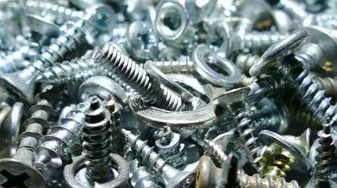 Group of  bolts ,  screw, nuts, rotates. 4K macro   shot 스톡 동영상 61653076