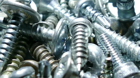 Group of  bolts ,  screw, nuts, rotates. 4K macro  slow rotation  库存影片 61653097