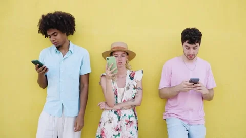 Group of bored friends using their smartphones Stock Footage 339006309