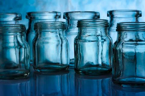 A group of bottle on blue  background Stock Photos