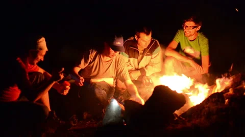 A group of boys spending time at campfire making barbecue Stock Footage 40394910