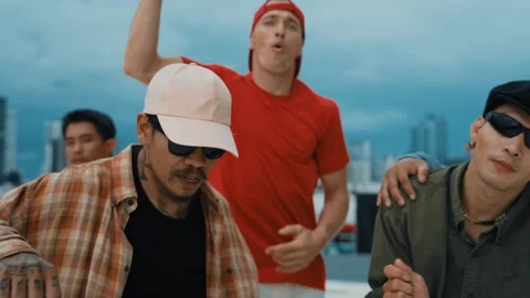 Group of break dancer putting their hands up in the air at roof top. hiphop Stock Footage 258337795