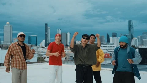 Group of break dancer putting their hands up in the air at roof top. hiphop Stock Footage 266847213