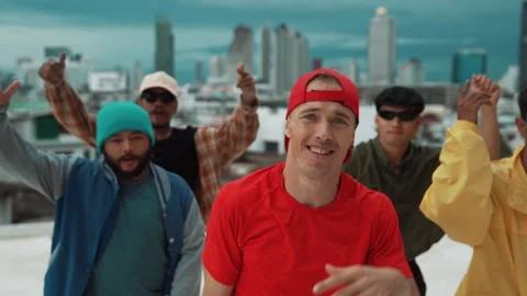 Group of break dancer putting their hands up in the air at roof top. hiphop Stock Footage 272990637