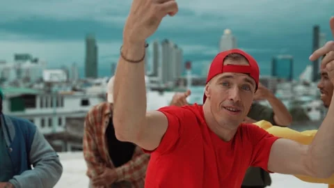 Group of break dancer putting their hands up in the air at roof top. hiphop Stock Footage 274930720