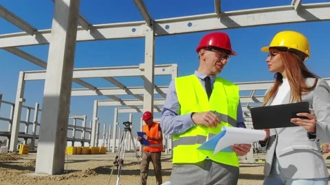 Group of builders and architect on construction site, teamwork Stock Footage 140267587