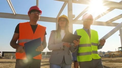 Group of builders and architect on construction site, teamwork Stock Footage 140684027