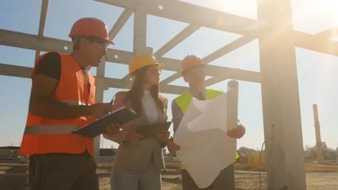 Group of builders and architect on construction site, teamwork Stock Footage 140684106