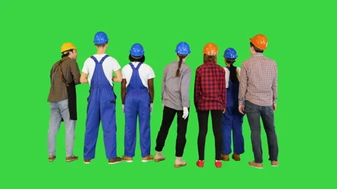 A group of builders looking at the object on a Green Screen, Chroma Key. Stock Footage 156865007