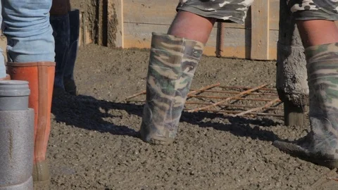 A Group Of Builders Pouring Concrete. The Foundation of house Stock Footage 117295161
