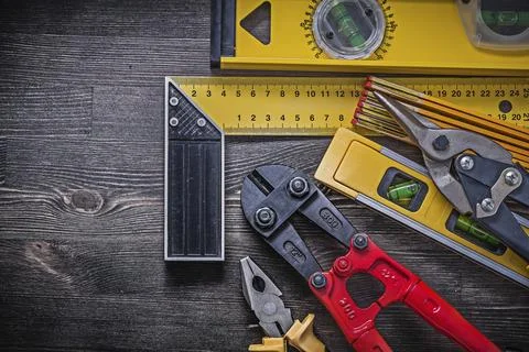 Group of building elements on a wooden background Maintenance concept Stock Photos