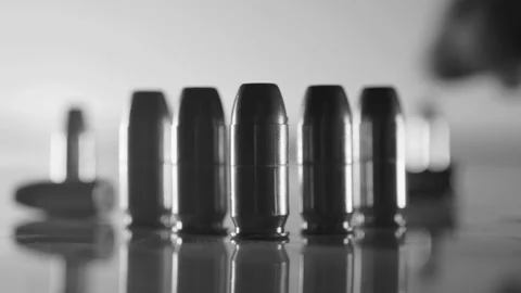 Group of Bullets Being Handled Stock Footage 138452446