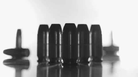 Group of Bullets Being Handled by Gloved Hand Stock Footage 138452641
