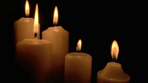 Group of burning candles on black background. Obscurity. Hope in the dark Stock Footage 115671611