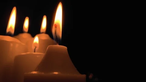 Group of burning candles on black background. Obscurity. Hope in the dark Stock Footage 115671624