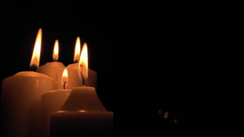 Group of burning candles on black background. Obscurity. Hope in the dark Stock Footage 115671693