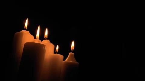 Group of burning candles on black background. Obscurity. Hope in the dark Stock Footage 115671819