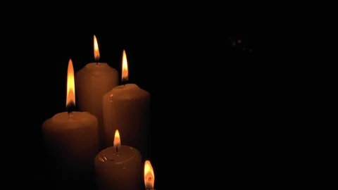 Group of burning candles on black background. Obscurity. Hope in the dark Stock Footage 115671828