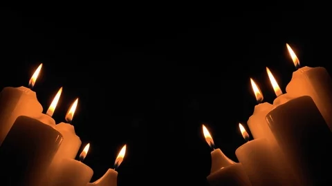Group of burning candles on black background. Obscurity. Hope in the dark.  Stock Footage 115951828